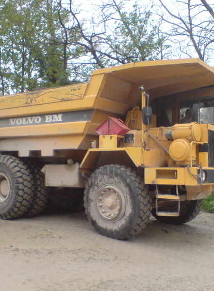 Dump truck in the quarry for transporting limestone and rock